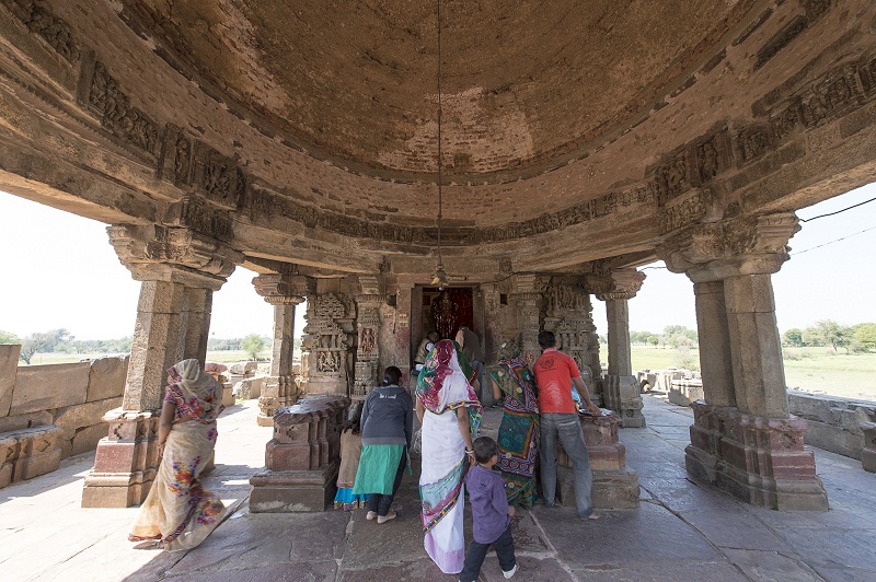 local people visiting Harshat Mata temple next to the Chand Baori in Abhaneri, consisting of three large stepped terraces, dating from the ninth or tenth centuries.